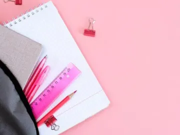 school supplies with pink background